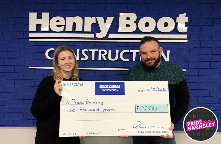 Administrator Chloe Goddard presenting Operations Manager Nick Cox with the cheque